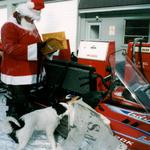 Residents of Lake during the 1980s sometimes waited several weeks for mail, but this Christmas Santa brought the holiday mail. Santa was Ranger John Edwards, and the dog investigating the packages was Mack.  