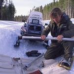 Ranger Alice Siebecker prepares to snowshoe to a Lake Snow Course site to take snow core samples of snow depth and moisture content. Most snow courses in the country – including this one – later relied on automated weather stations. 1992 photo by Mike McClure