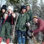 Family and friends braved treacherous roads on snowmobiles when they visited. Pictured are Scott Wehrman, Jason Wilkes, Marjane, Terry, and Ed Ambler.