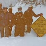 Marjane's sister, Rebecca Strouse, and her family came to Yellowstone from New Caledonia in 1992, trading their tank tops for snowmobile suits. Pictured are Gary and Rebecca, their three girls, and Terry on top of Sylvan Pass. 